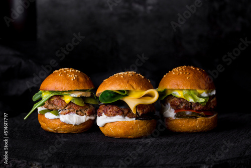 Three burgers with cutlets