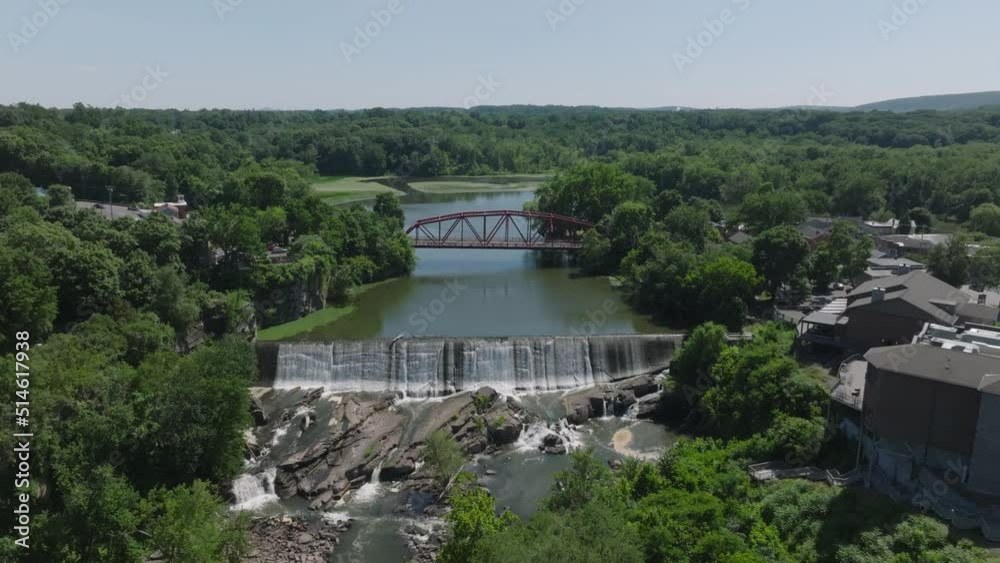 flying over waterfall towards iconic bridge of Saugerties New York flying over waterfall towards iconic bridge of Saugerties New York