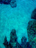 Aerial view of the seascape with turquoise blue sea. Conceptual background of summer beach vacations.