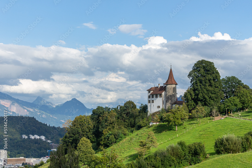 house on a green hill Pilatus Switzerland