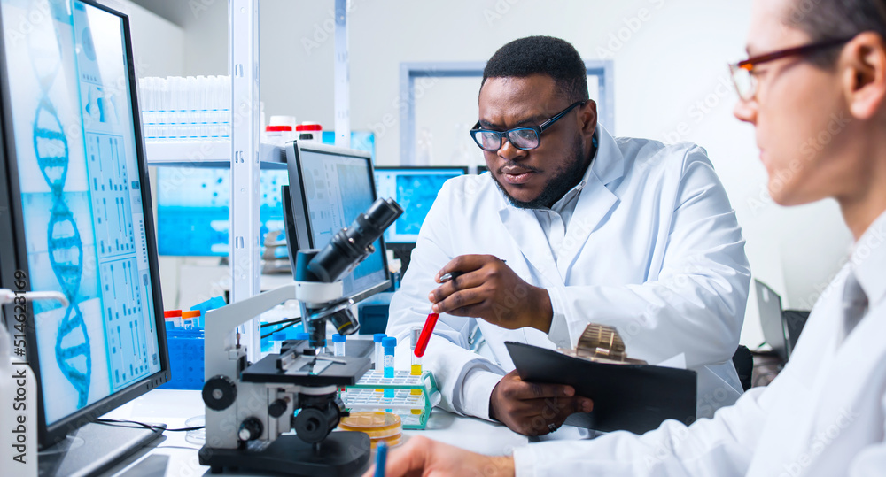 Professional Doctors Doing Monkeypox Research in a Modern Futuristic Laboratory. Lab Experiments in Clinic Hospital. Science and Medicine Concept. Professional Doctors Doing Monkeypox Research in a Modern Futuristic Laboratory. Lab Experiments in Clinic Hospital. Science and Medicine Concept.