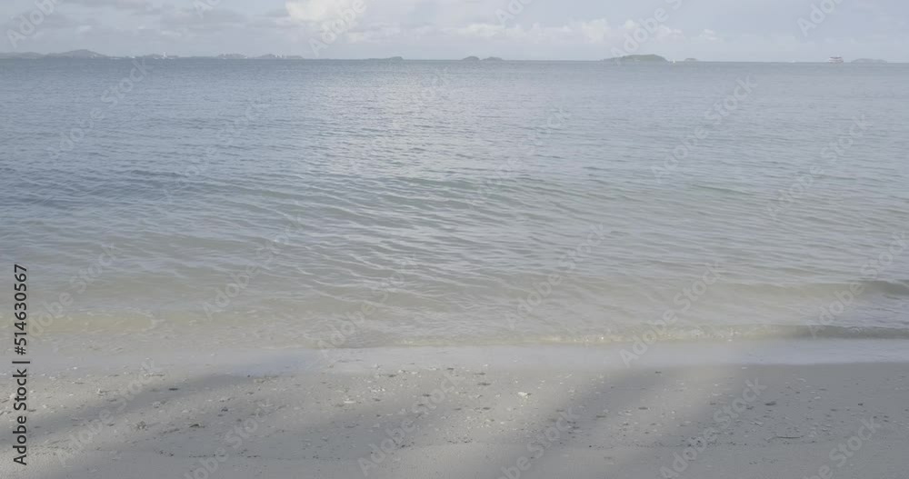 Sea beach with wave white sand turquoise water blue sky cloud summer vacation background