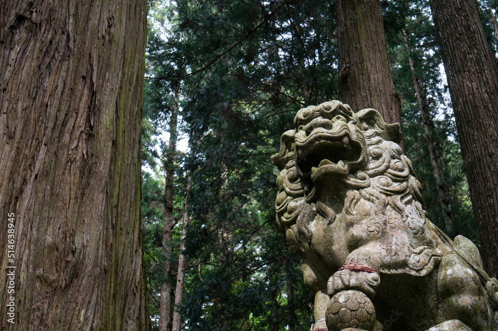 A powerful stone statue of the guardian deity of Murou Ryuketsu Shrine in Nara, Japan