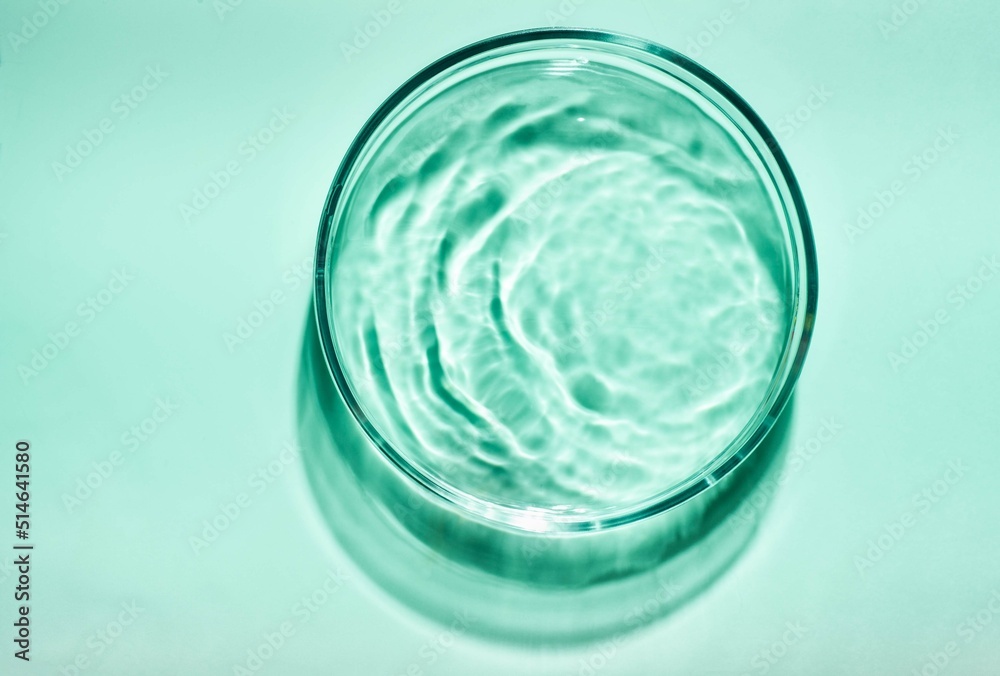 Blue green cosmetic liquid on Petri dish. Tonic or toner serum gel swath. Mock up Blue green cosmetic liquid on Petri dish. Tonic or toner serum gel swath. Mock up