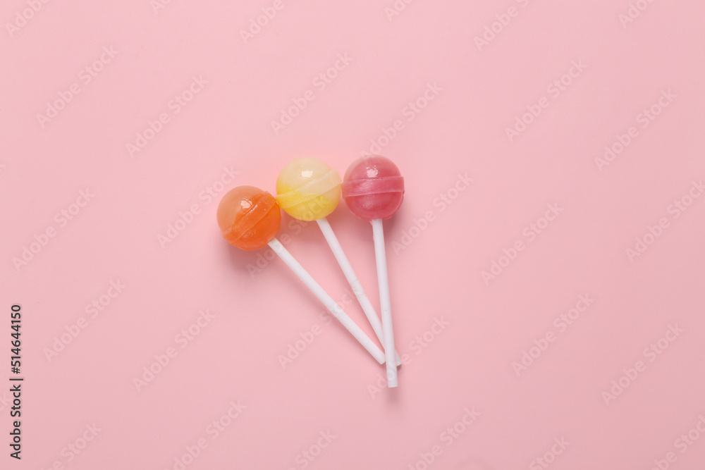Balls Lollipops on a pink pastel background. Top view Balls Lollipops on a pink pastel background. Top view