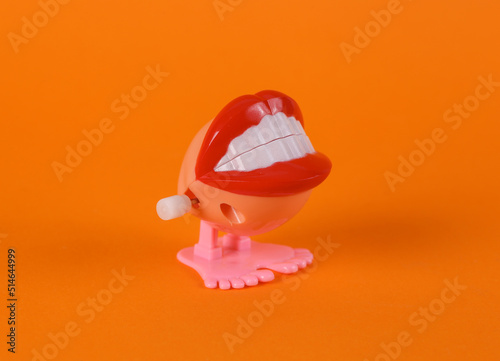 Canvas Print Clockwork halloween toy monster lips on orange background