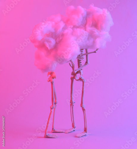 Love or Halloween concept. Two skeletons in a fluffy cloud in a red-blue neon light. Minimalism. Concept art