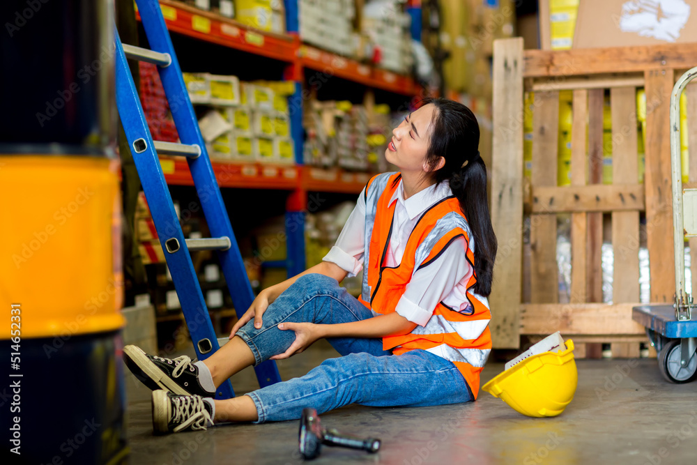 Woman worker has an accident on the floor in factory site Woman worker has an accident on the floor in factory site