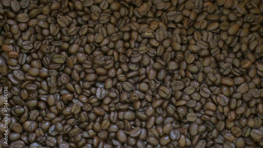 4K-Motion Shot of Falling Roasted Coffee Beans into Ground Coffee 4K-Motion Shot of Falling Roasted Coffee Beans into Ground Coffee