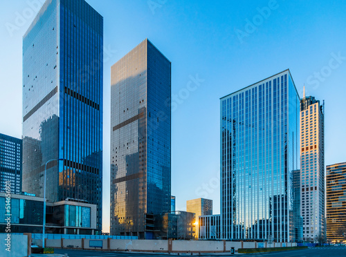 Urban skyscrapers under blue skies