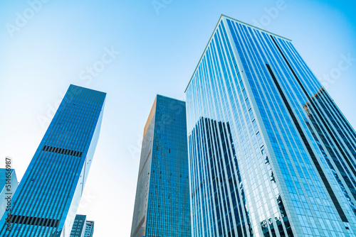 Urban skyscrapers under blue skies