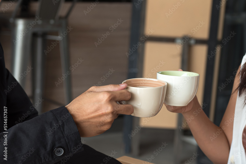 Two cups of coffee cups in man and woman hands. Two cups of coffee cups in man and woman hands.