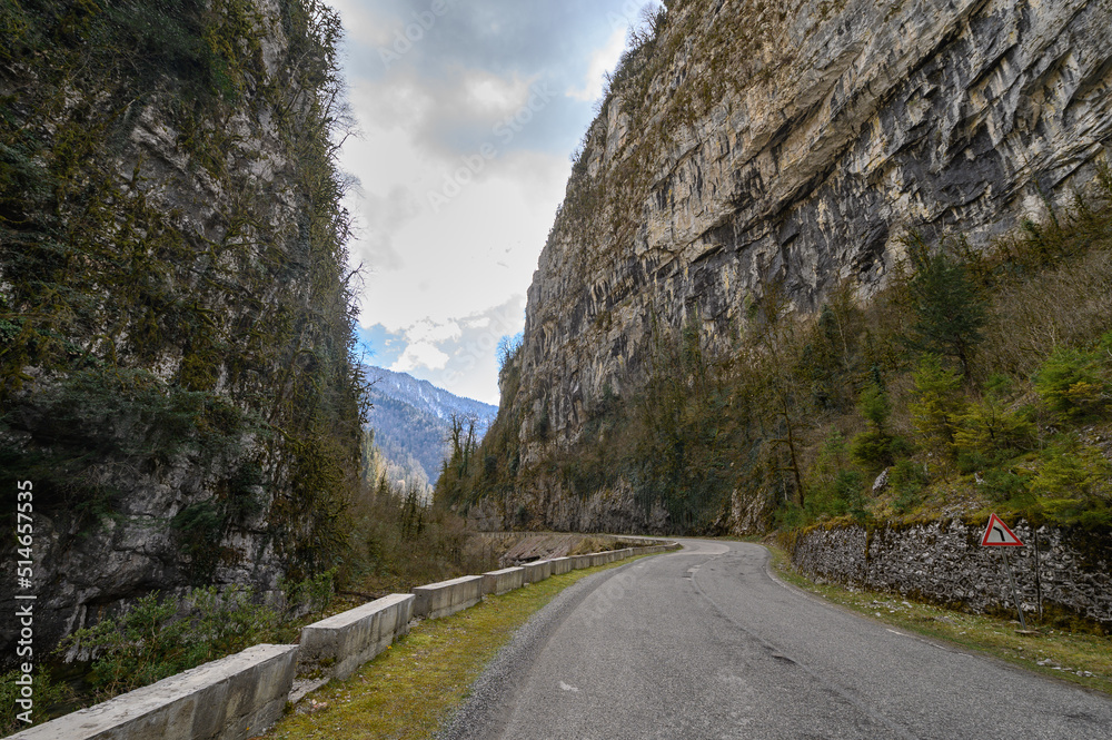 Mountain road with steep cliffs. Beautiful road landscape