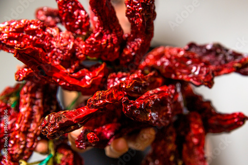 Closeup of peperoni cruschi, an air-dried crunchy sweet pepper used in the cuisine of Basilicata in Italy. Typical product of Lucan cuisine on white background.  photo