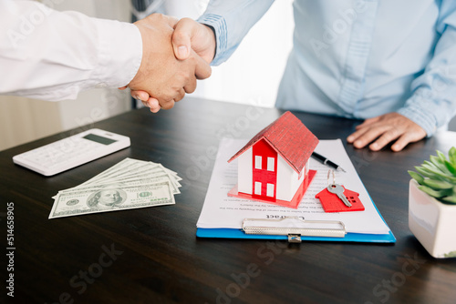 Real estate brokers or real estate agent with client or architect team Discussions about contracts , Saving money to invest in house or property in the future. Business property Concept.