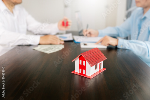 Real estate brokers or real estate agent with client or architect team Discussions about contracts , Saving money to invest in house or property in the future. Business property Concept.