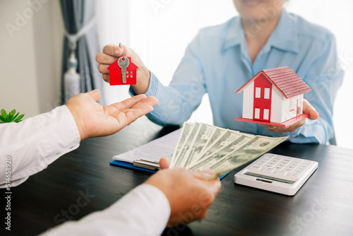 Real estate brokers or real estate agent with client or architect team Discussions about contracts , Saving money to invest in house or property in the future. Business property Concept.