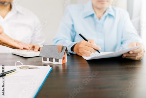 Real estate brokers or real estate agent with client or architect team Discussions about contracts , Saving money to invest in house or property in the future. Business property Concept.