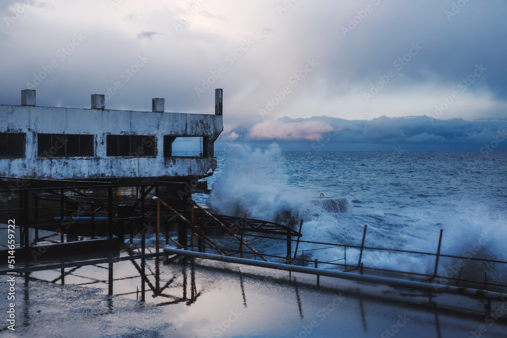 Fototapeta premium Storm at sea with waves during rain and cloudy in Alupka. Crimea