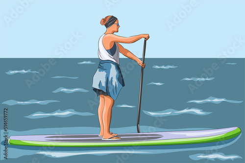 A young woman floats on a surfboard in the sea.