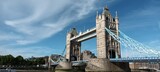 landscape of London tower bridges in summer with blue sky and ripple white cloud, sun light from southbank side