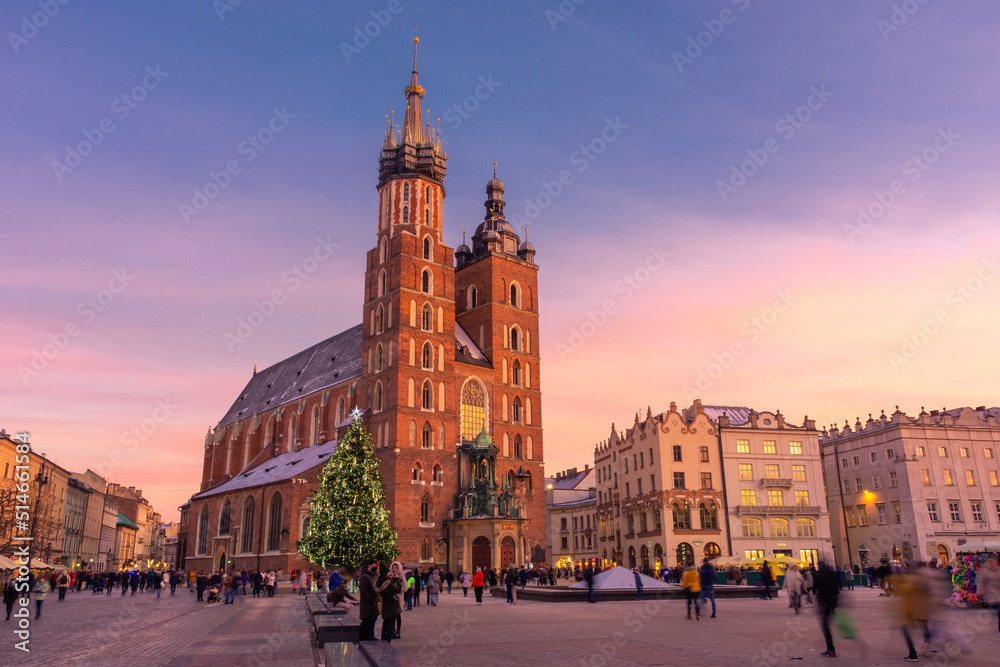 Sunset over the St. Mary's Basilica in Rynek Glowny square, Krakow, Poland