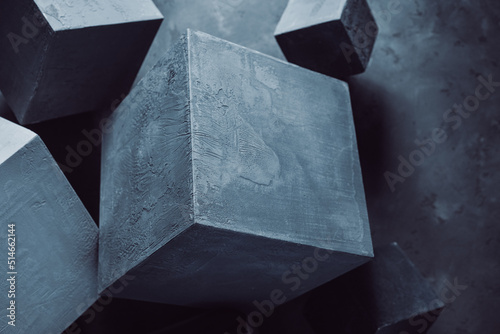 Cement blocks near wall background construction concept. Concrete cube shape abstract art idea