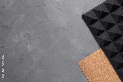 Acoustic foam and cork on concrete wall background. Sound isolation material for record studio