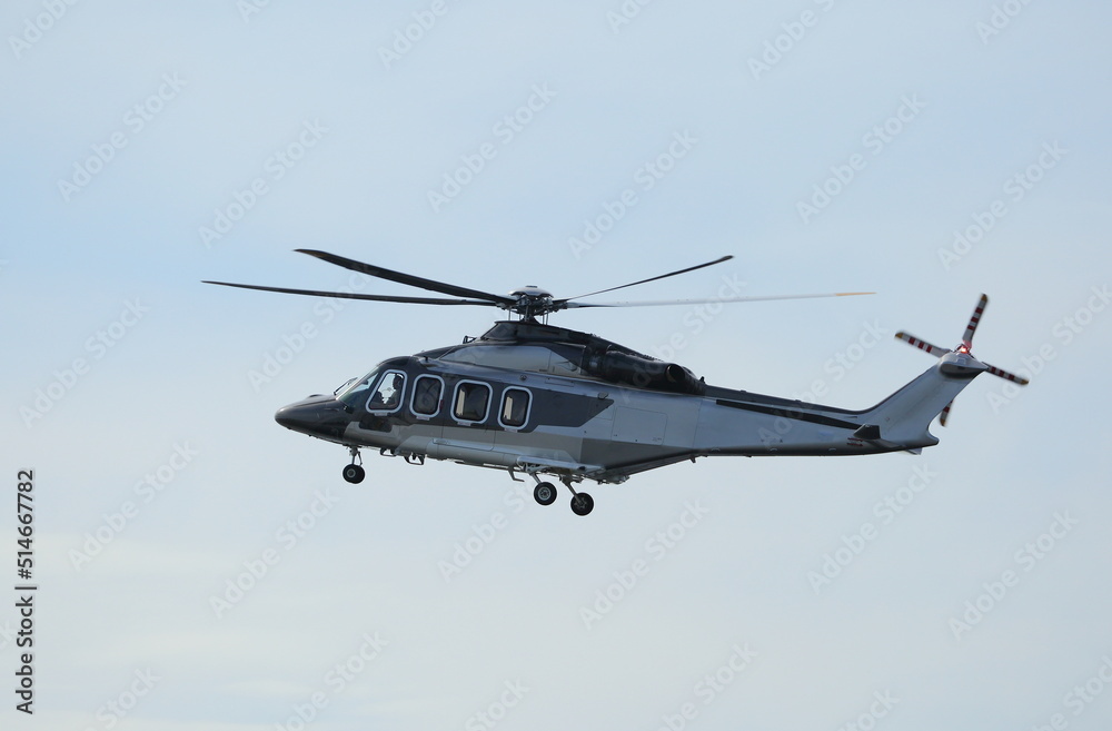 Helicopter flight in the blue sky, St. Petersburg, Russia, July 2022 Helicopter flight in the blue sky, St. Petersburg, Russia, July 2022