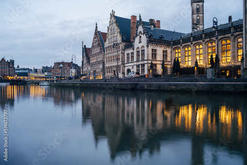 Houses reflected on the water of the canal in Ghent