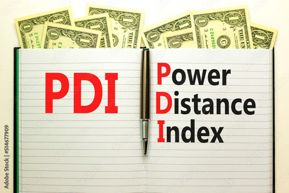 PDI power distance index symbol. Concept words PDI power distance index on white note on beautiful white background. Dollar bills. Metallic pen. Business PDI power distance index concept. Copy space.
