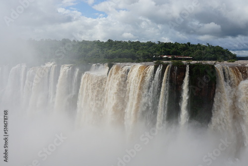 The photo shows a stunning view from the top of the Iguazu Falls     a complex of 275 waterfalls on the Iguazu River  located on the border of Brazil and Argentina