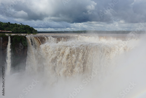 The photo shows a stunning view from the top of the Iguazu Falls     a complex of 275 waterfalls on the Iguazu River  located on the border of Brazil and Argentina