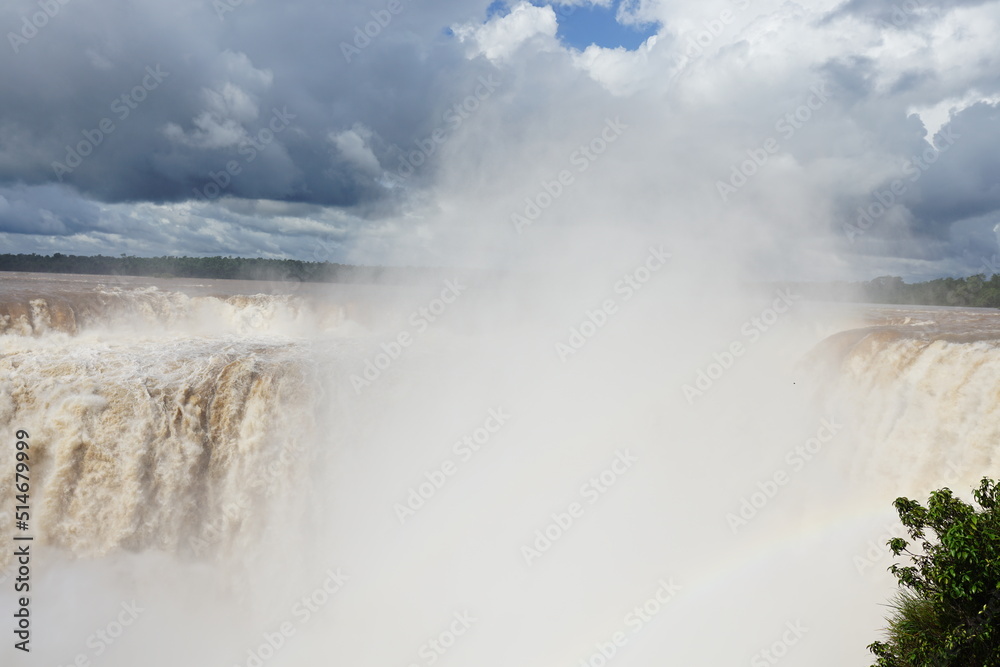 The photo shows a stunning view from the top of the Iguazu Falls — a complex of 275 waterfalls on the Iguazu River, located on the border of Brazil and Argentina