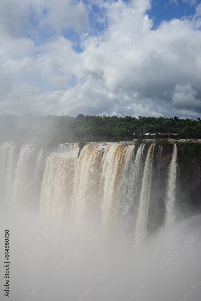 The photo shows a stunning view from the top of the Iguazu Falls — a complex of 275 waterfalls on the Iguazu River, located on the border of Brazil and Argentina