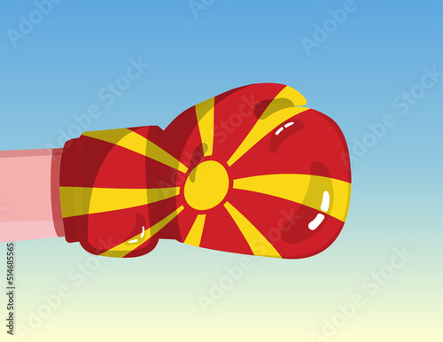 Flag of North Macedonia on boxing glove. Confrontation between countries with competitive power. Offensive attitude. Separation of power. Template ready design.