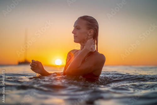 Caucasiam woman taking a dip in the Ocean