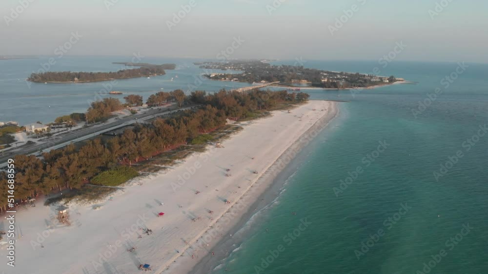Aerial view of Anna Maria island of Florida, close up beach view then zooming out to skyline with chain of islands
