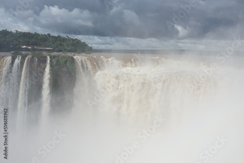 The photo shows a stunning view from the top of the Iguazu Falls     a complex of 275 waterfalls on the Iguazu River  located on the border of Brazil and Argentina