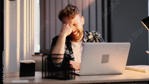 Upset businessman feeling stress, guy crying. Office worker male comically funny suffering sitting at office.