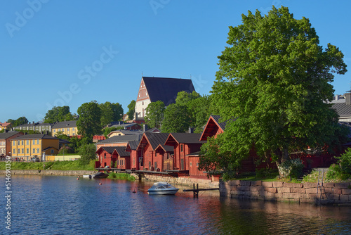 Panorama of old Finnish city of Porvoo: summer, sunny day, river, bridge, old wooden houses, medieval church.