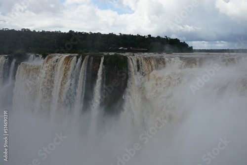 The photo shows a stunning view from the top of the Iguazu Falls     a complex of 275 waterfalls on the Iguazu River  located on the border of Brazil and Argentina