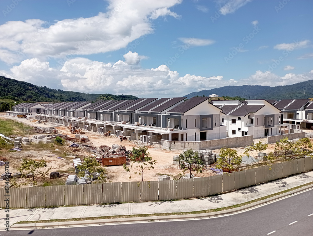 SEREMBAN, MALAYSIA -MARCH 4, 2021: Selected focused on double story terrace house under construction in Malaysia. Designed by an architect with a modern and suite with tropical climate. 
