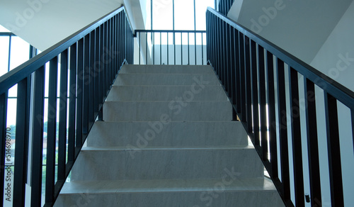 Indoor ceramic staircase. White ceramic staircase with minimalist design
