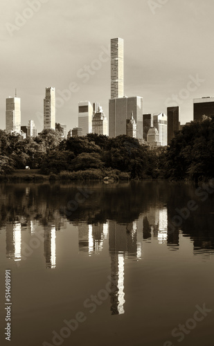 Iconic New York skyscrapers reflected in Central Park s lake in Black and White. 