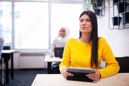 Free Download Multi ethnic students listening to a lecturer in a classroom. Smart young people study at a college. - GFXLoad