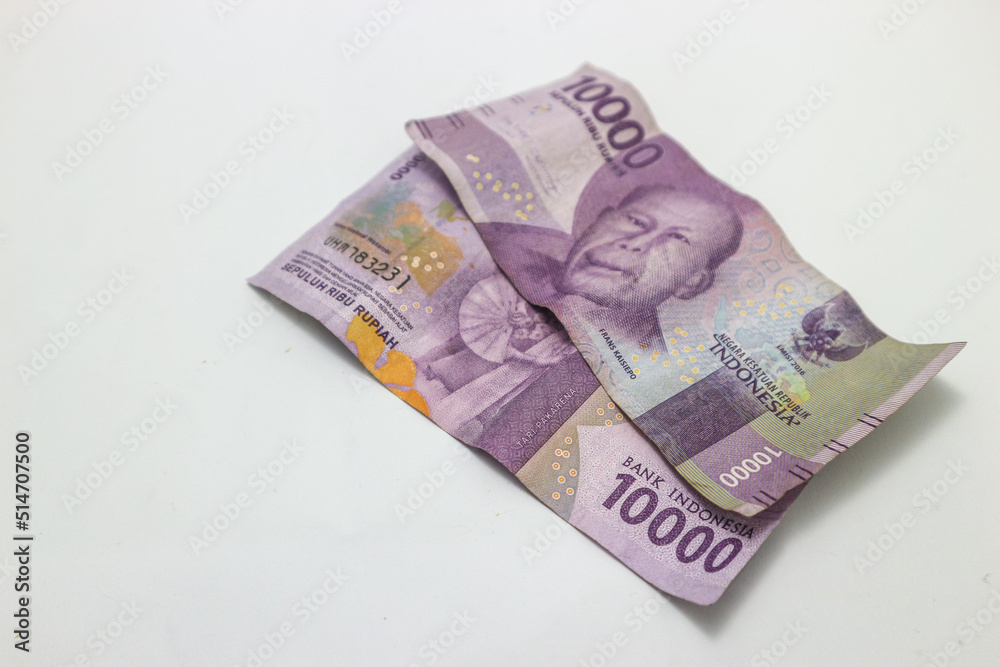 10000 rupiah banknote. Indonesian currency 2000 rupiah isolated on black background, financial concept.