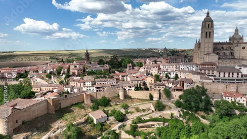 Aerial footage of Segovia old town with views of the Alcazar, Cathedral, medieval city walls