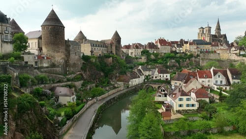 Aerial view of Semur en Auxois in Burgundy with medieval city perched on a rock above the river, four tower castle, one of the most beautiful small towns in France