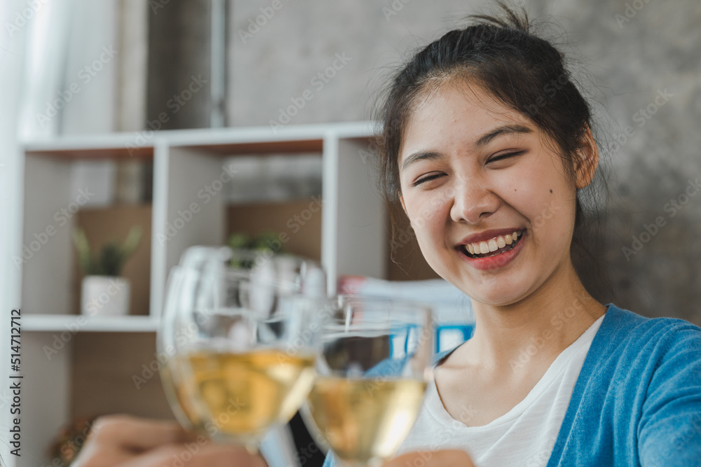 Group of young Asians clinking white wine glasses, startup company parties, New Year's parties, annual company parties, alcoholic beverages. Company employee party catering ideas, celebrations. Group of young Asians clinking white wine glasses, startup company parties, New Year's parties, annual company parties, alcoholic beverages. Company employee party catering ideas, celebrations.